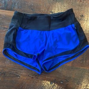 Lululemon running short blue with black trim size 4